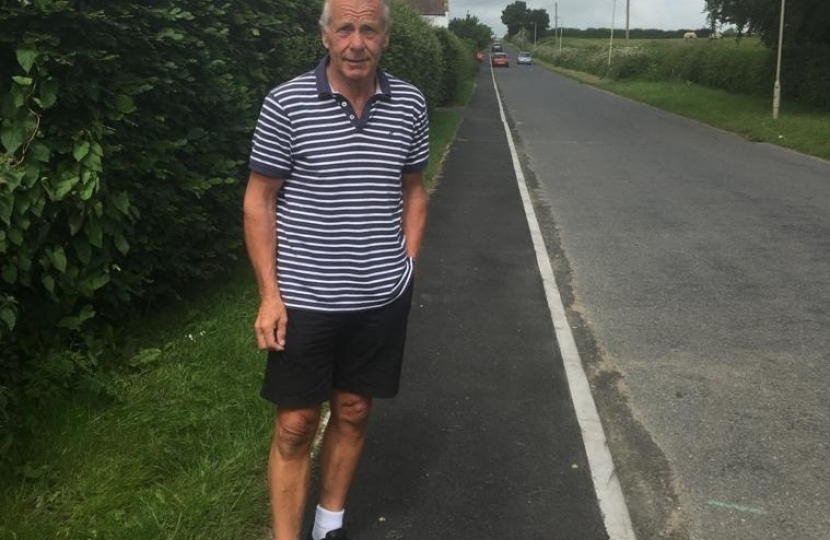 Local Councillor Derek Bastiman trying out the improved footpath